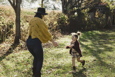 Girl running to mother, Oshawa, Canada, North America - ISF06334