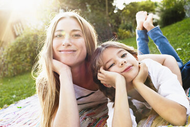 Mother and daughter smiling towards camera - CUF13792