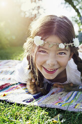 Girl with flowers round head, portrait - CUF13796