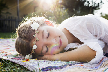 Girl with flowers round head sleeping - CUF13798