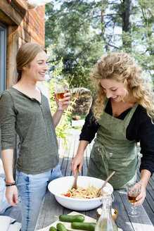 Two friends preparing lunch al fresco - CUF13831