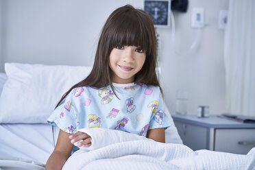 Portrait of girl patient with arm plaster cast in hospital children's ward - CUF14063