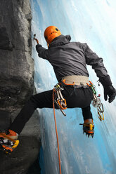 Rear view of man in cave ice climbing, Saas Fee, Switzerland - CUF14190