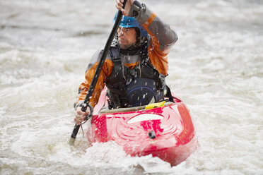 Male kayaker paddling River Dee rapids - CUF14229
