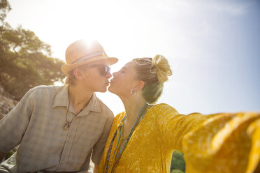 Couple in sunlight kissing, Majorca, Spain - CUF14291