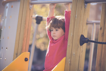 Portrait of pensive little girl on playground - JSMF00205