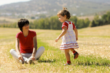 Mother and little daughter enjoying a day together at countryside - JSMF00211