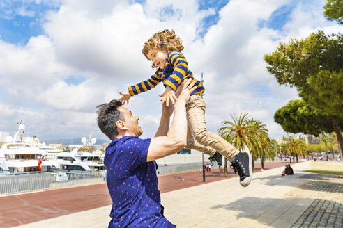 Spain, Barcelona, father and son playing together and having fun - WPEF00386