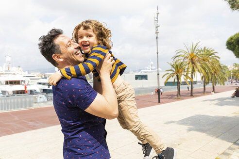 Spain, Barcelona, father and son playing together and having fun - WPEF00387