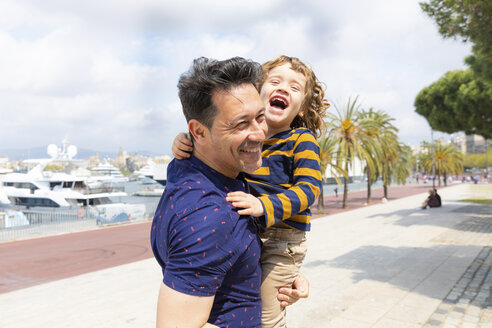 Spain, Barcelona, father and son playing together and having fun - WPEF00388