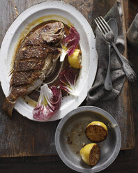 Whole grilled snapper on serving tray - CUF15584