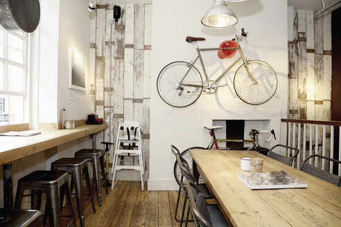 Quirky coffee shop interior with bicycle on wall - CUF15610