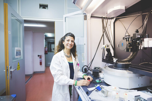 Female scientist preparing x-ray diffractometer - CUF15908