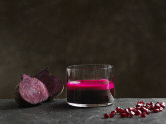 Purple raw beetroot and apple juice, halved beetroot and pomegranate seeds - CUF16122