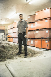 Portrait of scientist in plant growth research centre warehouse - CUF16483