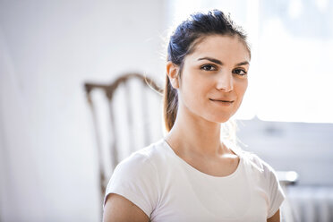 Head and shoulder portrait of beautiful young woman in shabby chic apartment - CUF16870