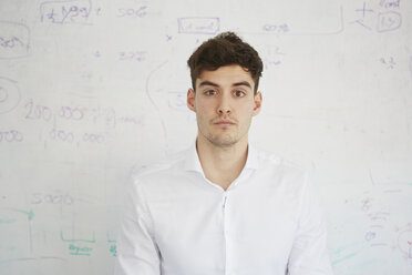 Man in front of white board looking at camera - CUF16911