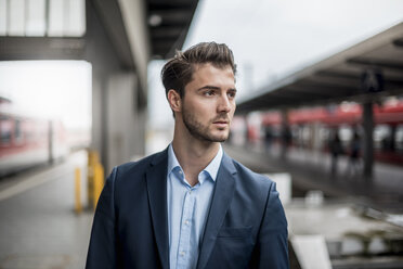 Businessman waiting at the platform - DIGF04547