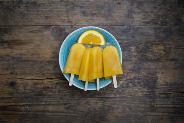 Home-made orange popsicles in bowl - LVF07007