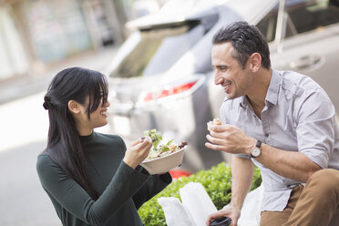 Couple at sidewalk cafe enjoying lunch - ISF06490