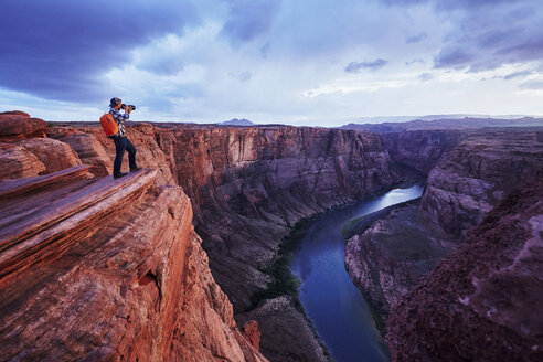 Photographer taking picture, Colorado River, Arizona - ISF06554
