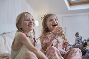 Girls laughing in loft room - CUF17898