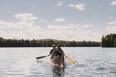 Senior couple canoeing on lake - CUF19185