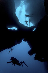 Diver swimming in cave system, Moalboal, Cebu, Philippines - CUF19277