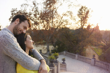 Couple in park hugging enjoying view - CUF19395