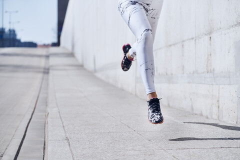Female runner during urban workout stock photo