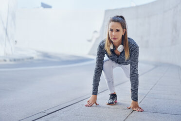 Woman stretching leg after jogging - BSZF00455