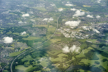 Aerial view of green fields and motorway, England, UK - CUF19781