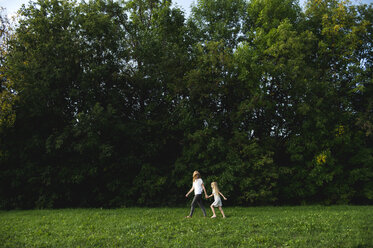 Mother and daughter walking in the park - CUF19941