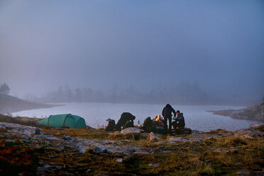 Hikers resting at camp, Sarkitunturi, Lapland, Finland - CUF20098