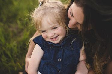 Mother hugging smiling girl - CUF20152