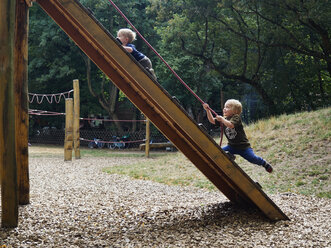 Two little boys having fun on playground - MUF01544