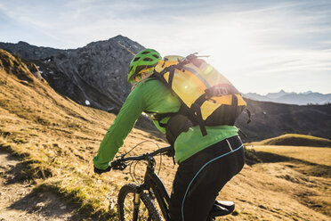 Cyclist on mountain biking area, Kleinwalsertal, trails below Walser Hammerspitze, Austria - CUF20859