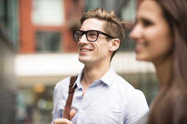 Young businessman and woman on street, London, UK - CUF21317