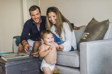 Couple smiling at happy son - ISF07884