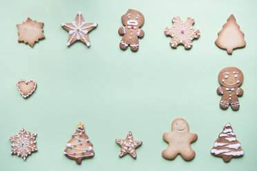 Various gingerbread decorated with sugar icing on bright green ground - SKCF00462