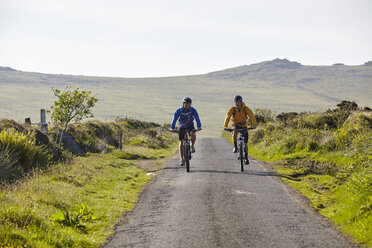 Front view of cyclists cycling on rural road - CUF21525