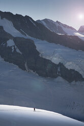 Lone climber on a glacier descending from the Jungfrau, Alps, Canton Bern, Switzerland - CUF21894