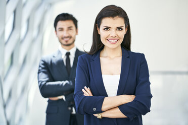 Portrait of smiling businesswoman and businessman - BSZF00518