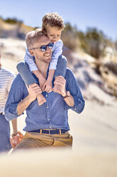 Happy father carrying son on shoulder at the beach - BEF00121