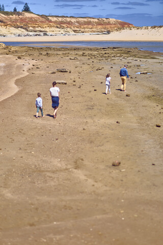 Australia, Adelaide, Onkaparinga River, family walking on the beach together stock photo
