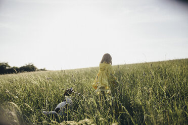 Little girl and dog in nature - KMKF00258