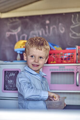 Portrait of boy playing in playhouse - BEF00159