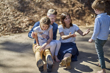 Family relaxing outdoors together - BEF00162