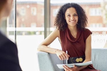 Portrait of young businesswoman in office meeting - CUF22237