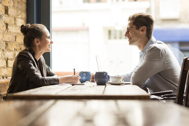 Young businessman and woman meeting in cafe - CUF22252